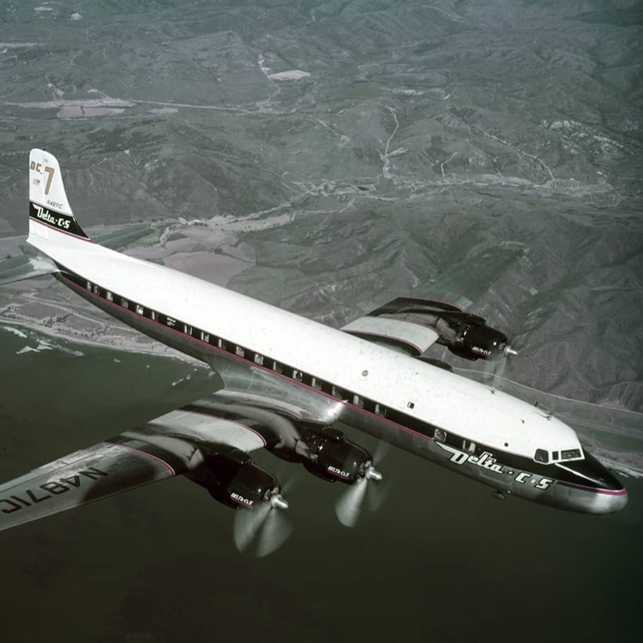 1954 Douglas DC-7 over coast