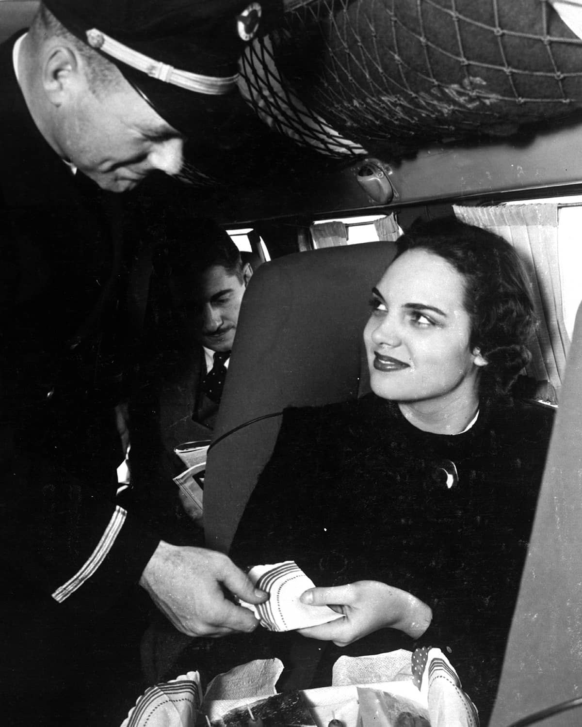 L-10 Electra co-pilot serving meal