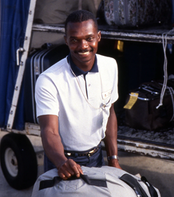placing_bag_on_conveyor_mid1990s_cropped